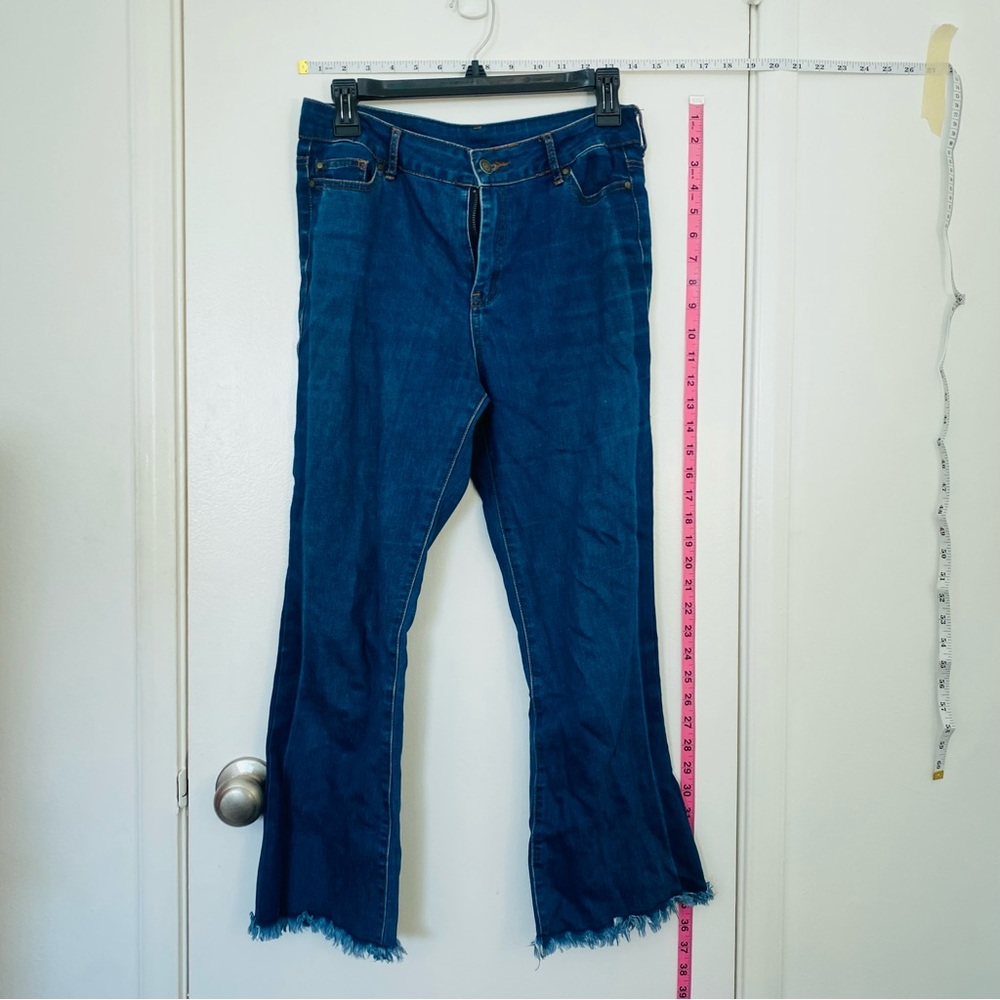 Medium Wash Raw Hem Flare Leg Jeans Mid Rise